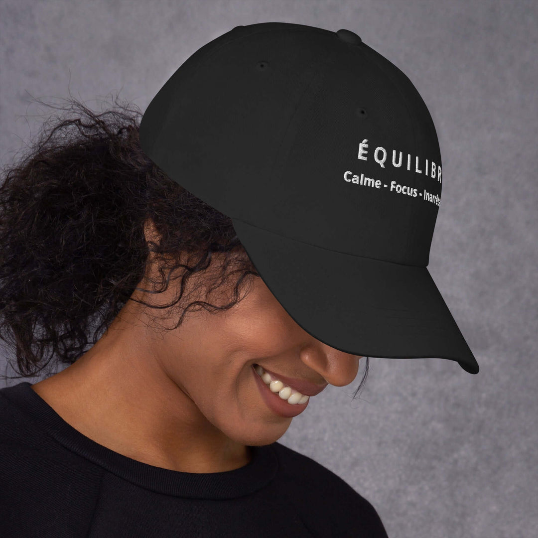 Black ÉQUILIBRE Calm Focus Unstoppable Cap worn casually stylish streetwear look