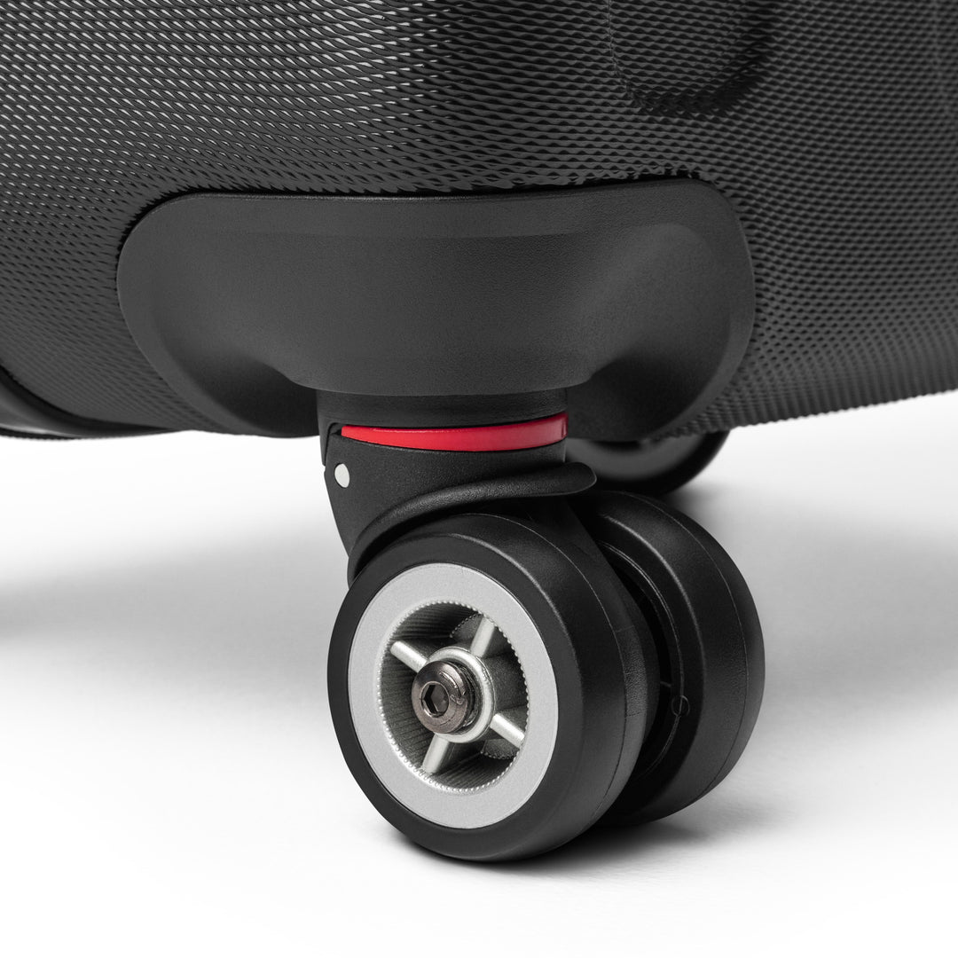 ÉQUILIBRE Suitcase Travel with Mastery black side view durable travel luggage modern design