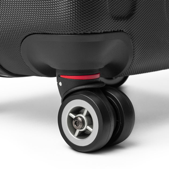 ÉQUILIBRE Suitcase Travel with Mastery black side view durable travel luggage modern design