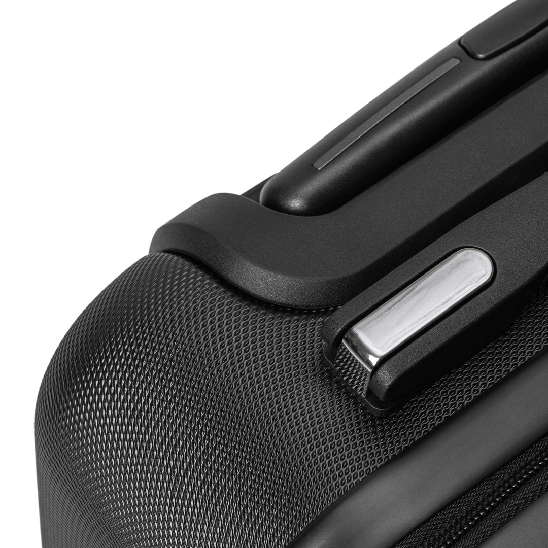 ÉQUILIBRE Suitcase Travel with Mastery black wheels and handle close up durable smooth travel mobility